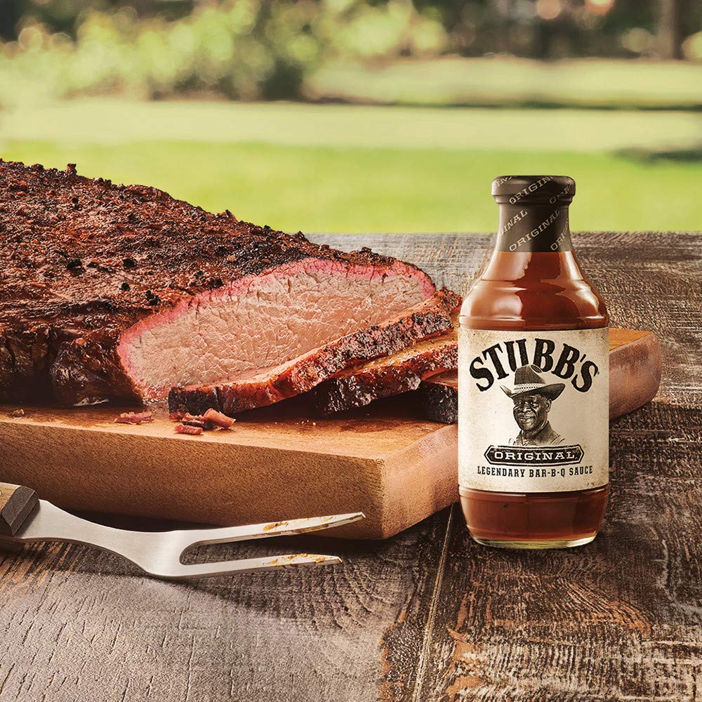Chicken wings coated in Stubb's BBQ Sauce during barbecue session.
