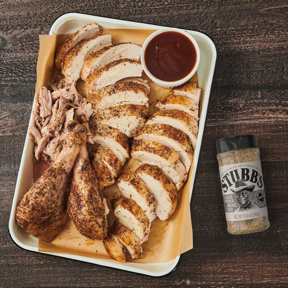 Stubb’s rub dusting pork chops for savory BBQ.