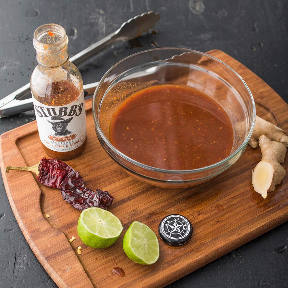 Basting pork with Stubb's marinade during cooking for depth