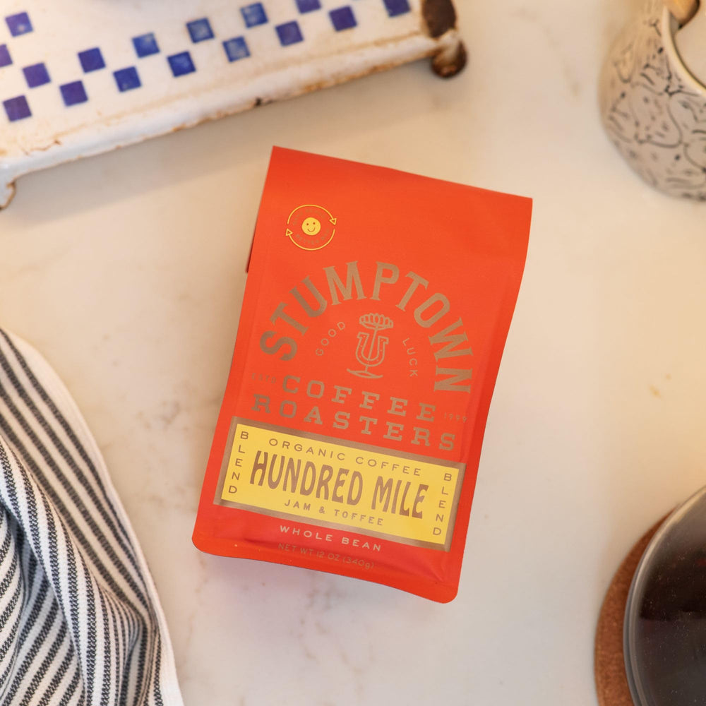 Preparing Hundred Mile with a pour-over setup for clean, bright flavors.