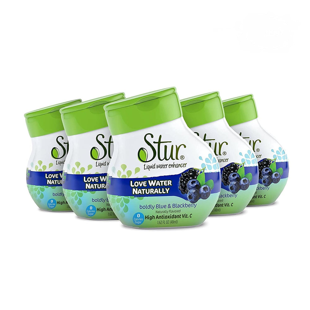 Stur Blue and Blackberry drink enhancer being poured into a glass for flavorful hydration.