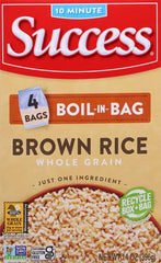 SUCCESS Cooked brown rice with fluffy texture, versatile base for casseroles.
