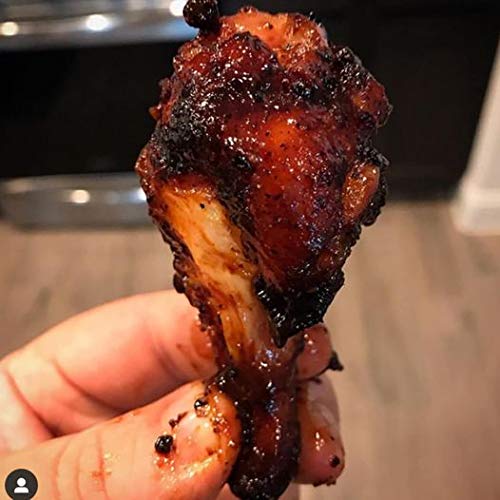 SuckleBusters Clucker Dust on grilled chicken with red BBQ color