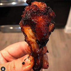 SuckleBusters Clucker Dust on grilled chicken with red BBQ color