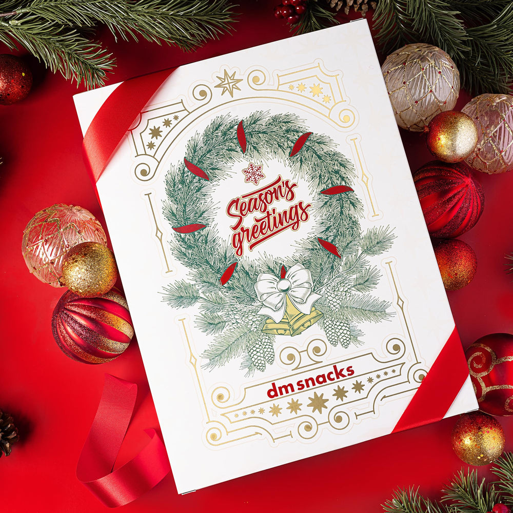 Sugar Plum Nuts Gift Basket closeup highlighting colorful snack labels and textures.