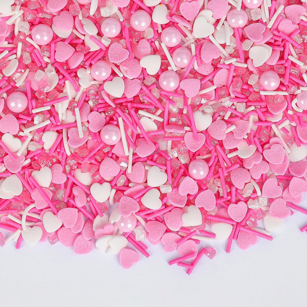 Sugarzy edible heart sprinkles pink and white decorate cupcakes beautifully.