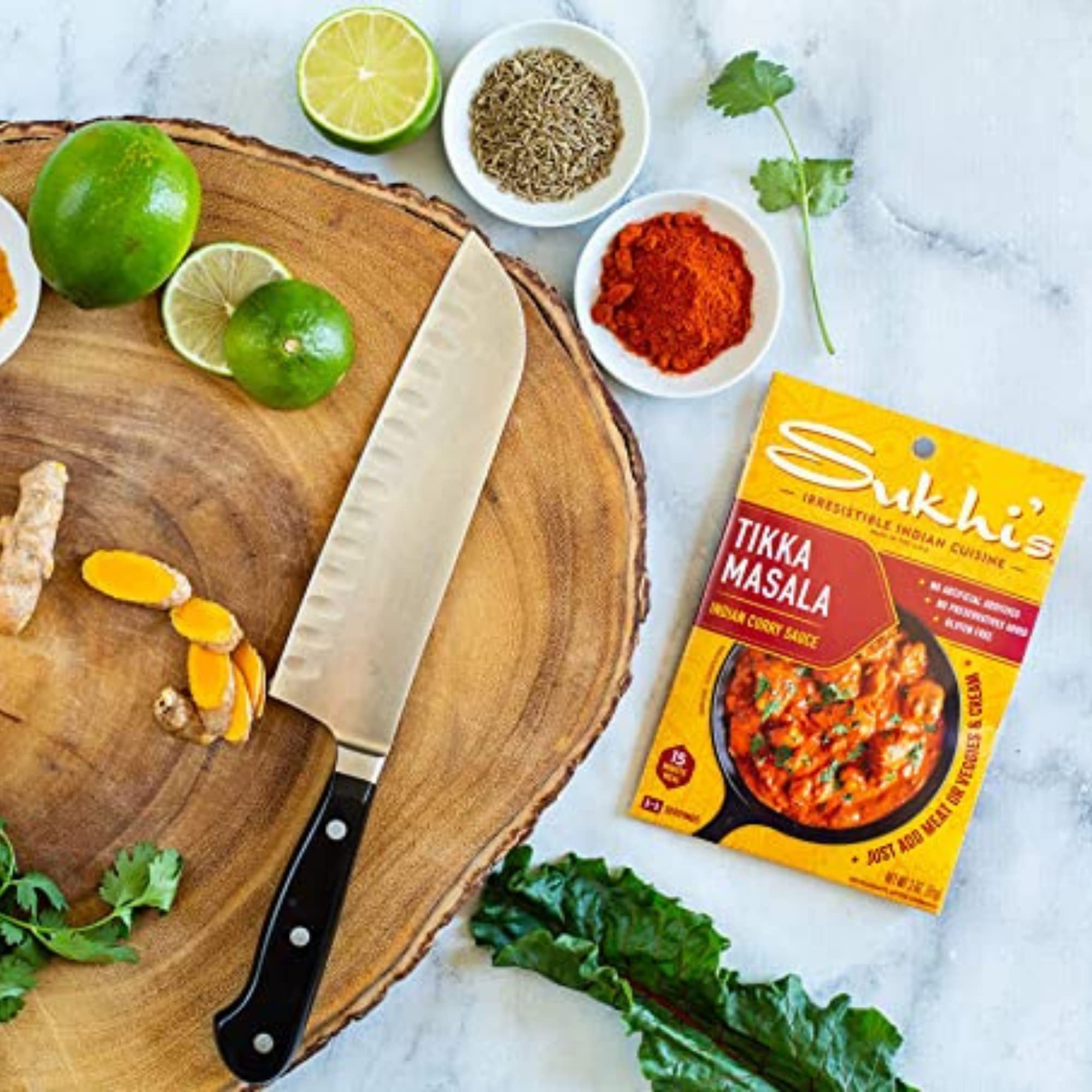 Sukhi's creamy tikka masala sauce poured over ingredients for curry.