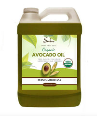 Sulu Organics avocado oil bottle pouring, ideal for cooking and dressings.