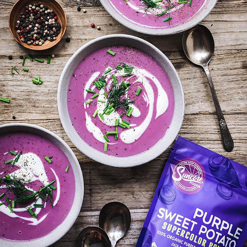Suncore Foods purple sweet potato powder being sprinkled with a spoon.