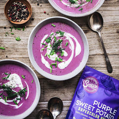 Suncore Foods purple sweet potato powder being sprinkled with a spoon.