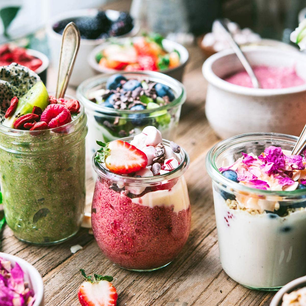Suncore Foods white chia seeds pouring into a smoothie for subtle thickening.