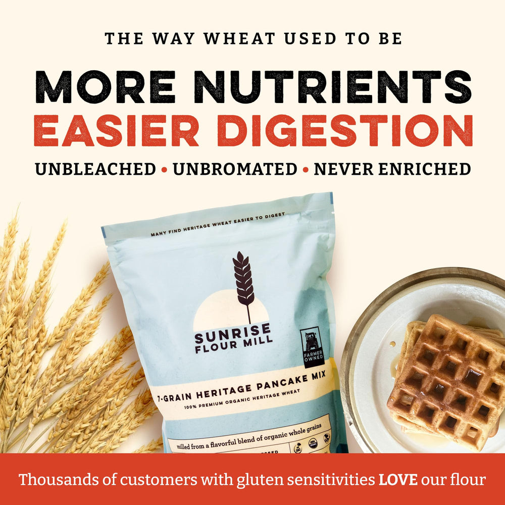 Golden waffles emerging from Sunrise Flour Mill waffle iron with crisp exterior.