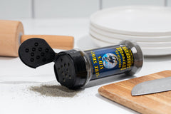 Sure Shot Sid’s BBQ rub on grilled meat showing even coating and rich color