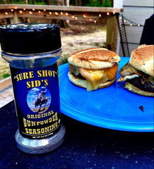 Ribs on grill with Gunpowder seasoning delivering rich aromas.