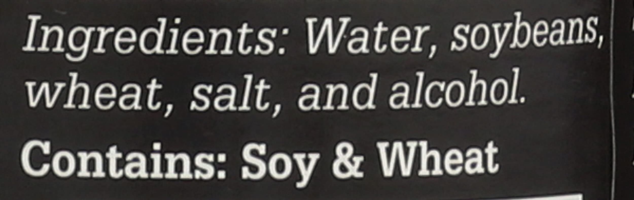 Sushi Chef dark soy sauce on a prep board for sushi rolls and marinating.