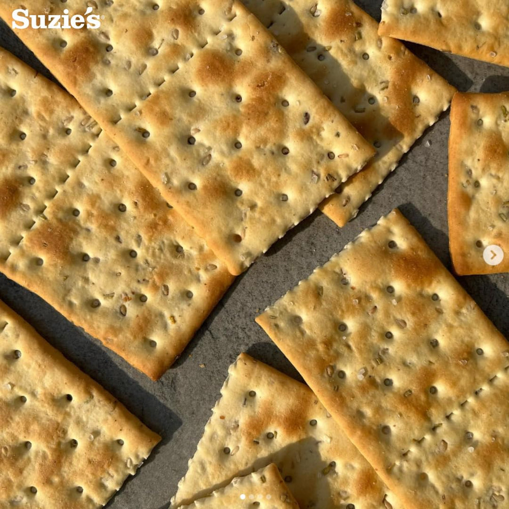 Suzie's Organic Saltines packaging detail—label lists no hydrogenated fats or cholesterol.