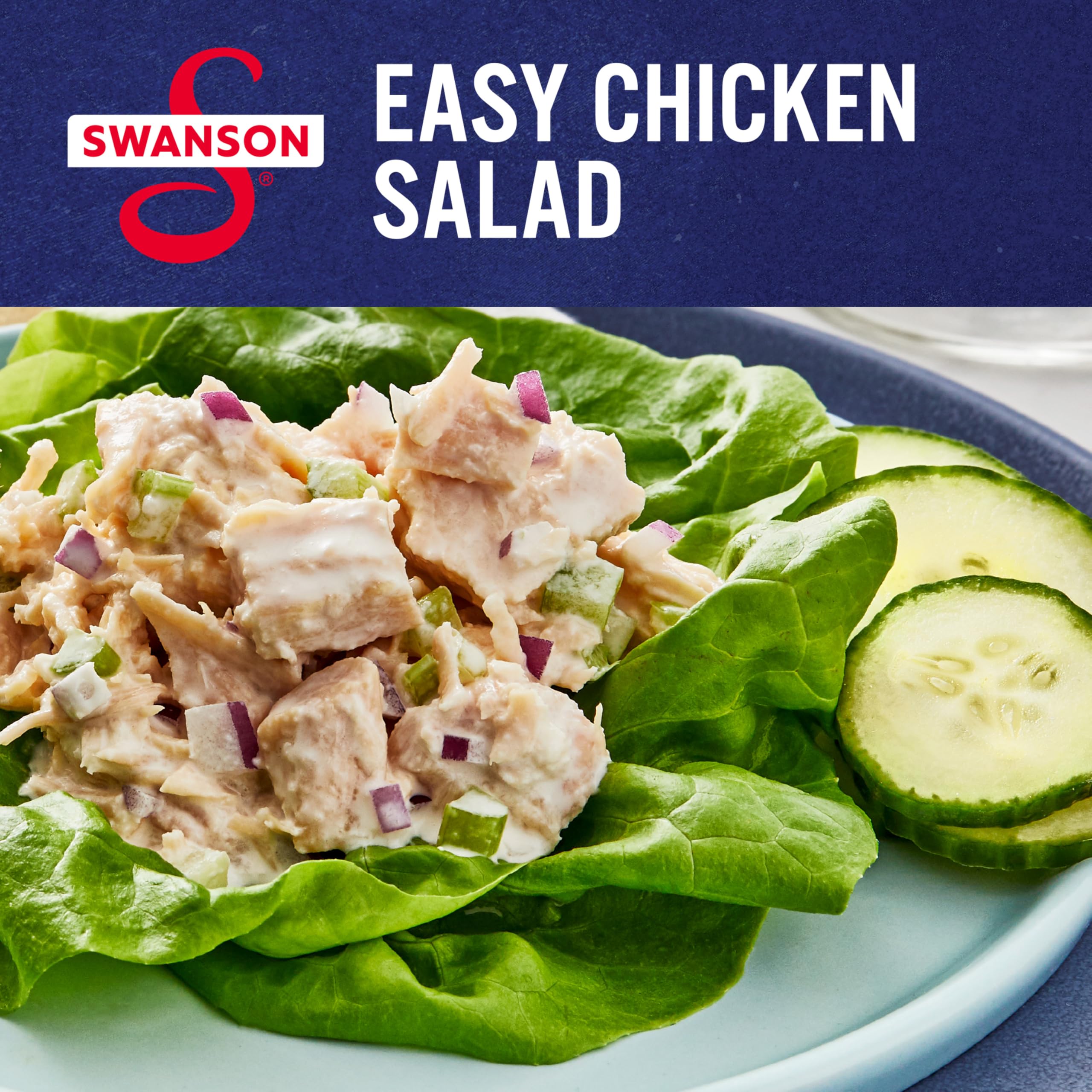 Open Swanson can with spoon showing ready-to-use chicken chunks.