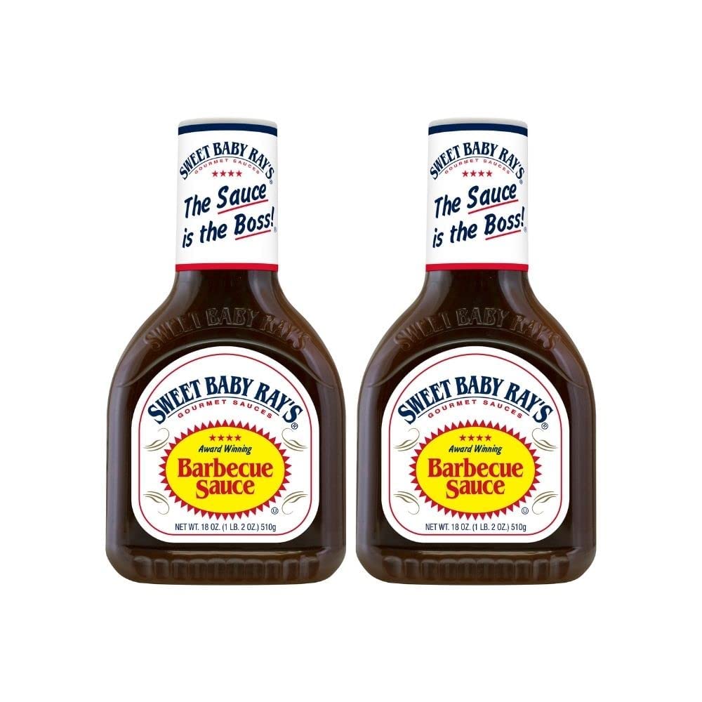 Sweet Baby Ray's BBQ sauce pours from 18oz bottle for easy glazing.