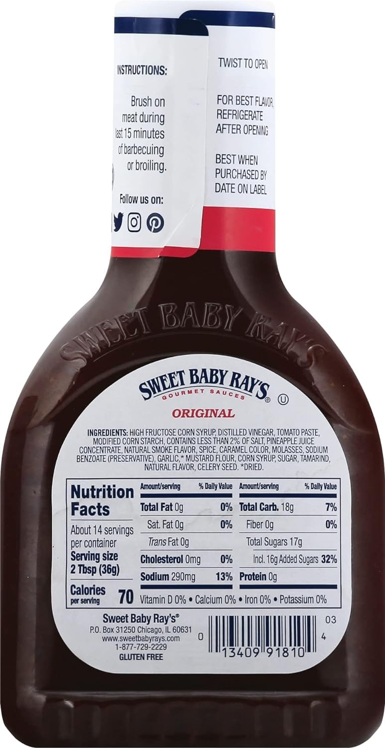 Sweet Baby Ray's bottle sits on the grill ready to glaze.