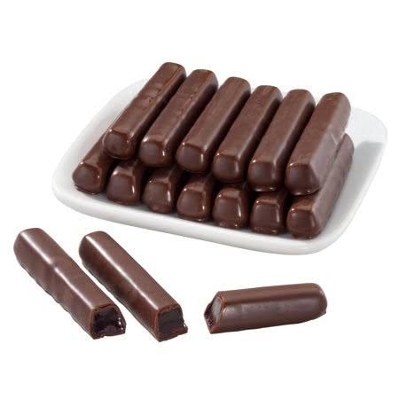 Sweet Candy Company dessert snack sticks on a wooden surface, perfect treat
