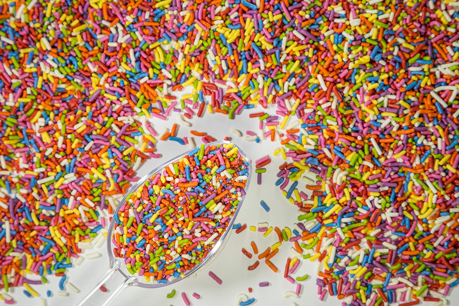 Sweet Eva's Rainbow Sprinkles on cookies for festive detail and crunch.