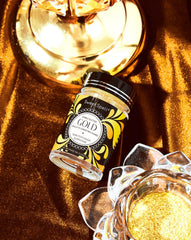 Sweet Spell Gold edible glitter dust sparkling drinks creates a shimmering surface for cocktails.