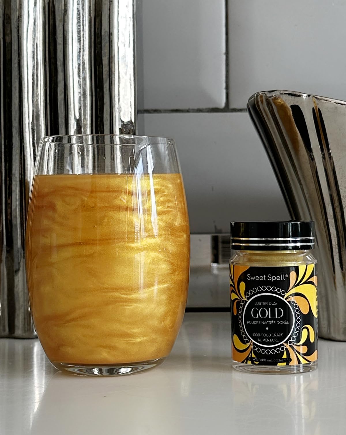 Sweet Spell Gold Luster Dust on drinks enhances visual wow for cocktails.