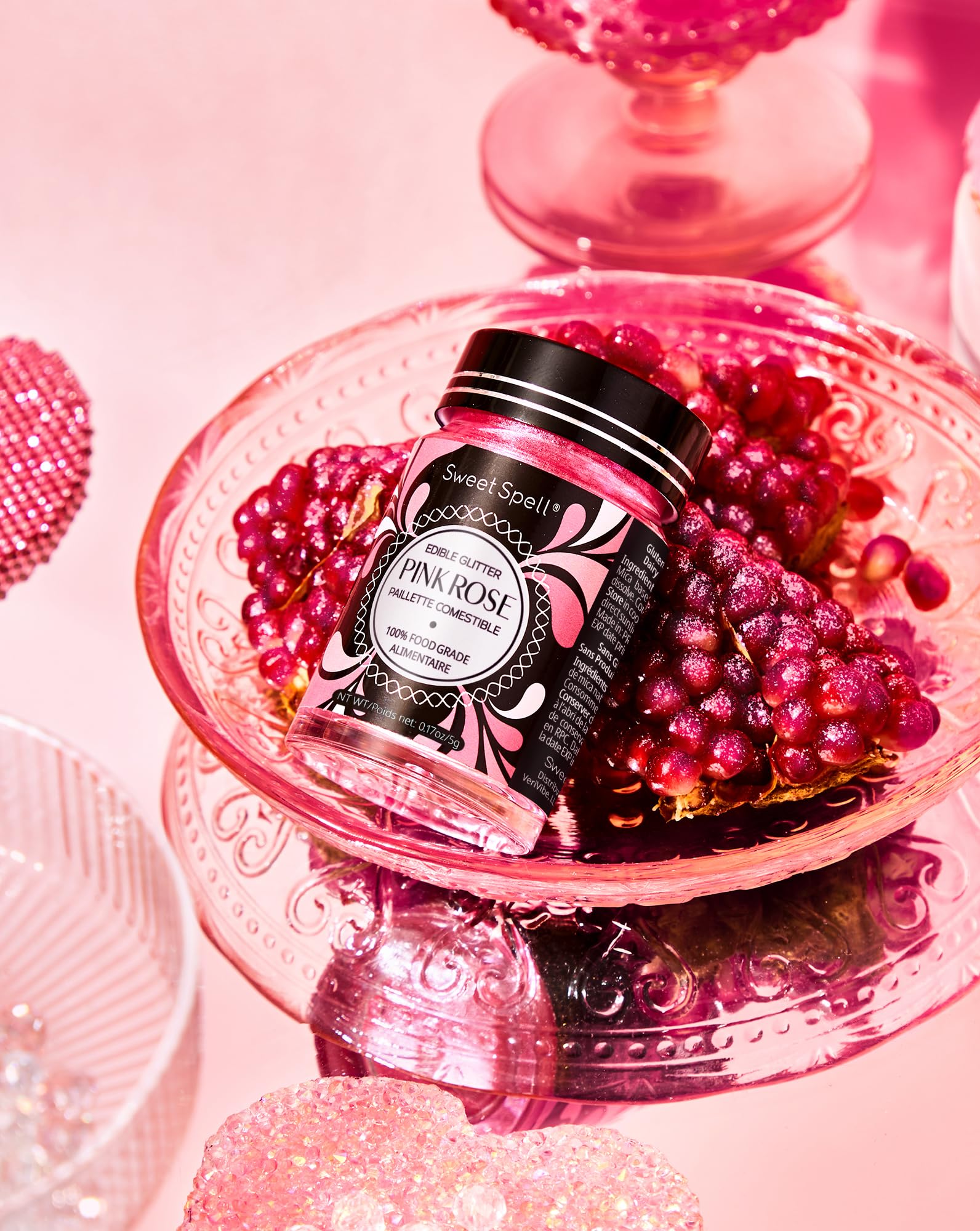 Sweet Spell pink edible glitter dusted on cake boosts festive sparkle.