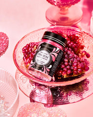 Sweet Spell pink edible glitter dusted on cake boosts festive sparkle.