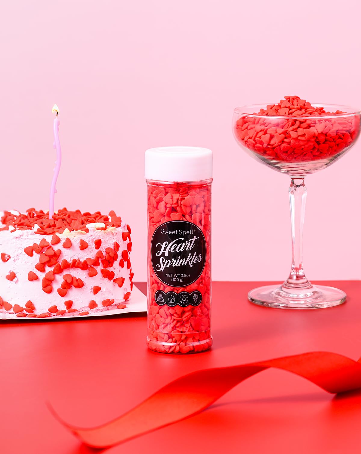 Sweet Spell red heart sprinkles on cupcakes for cute toppers.
