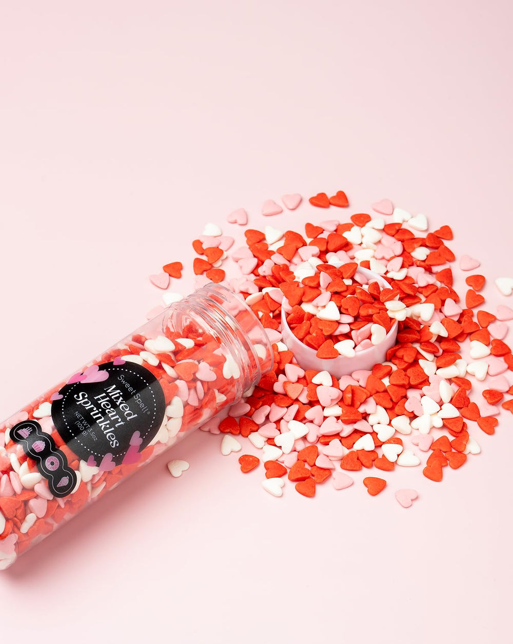 Sweet Spell resealable container keeps heart sprinkles fresh for celebrations.