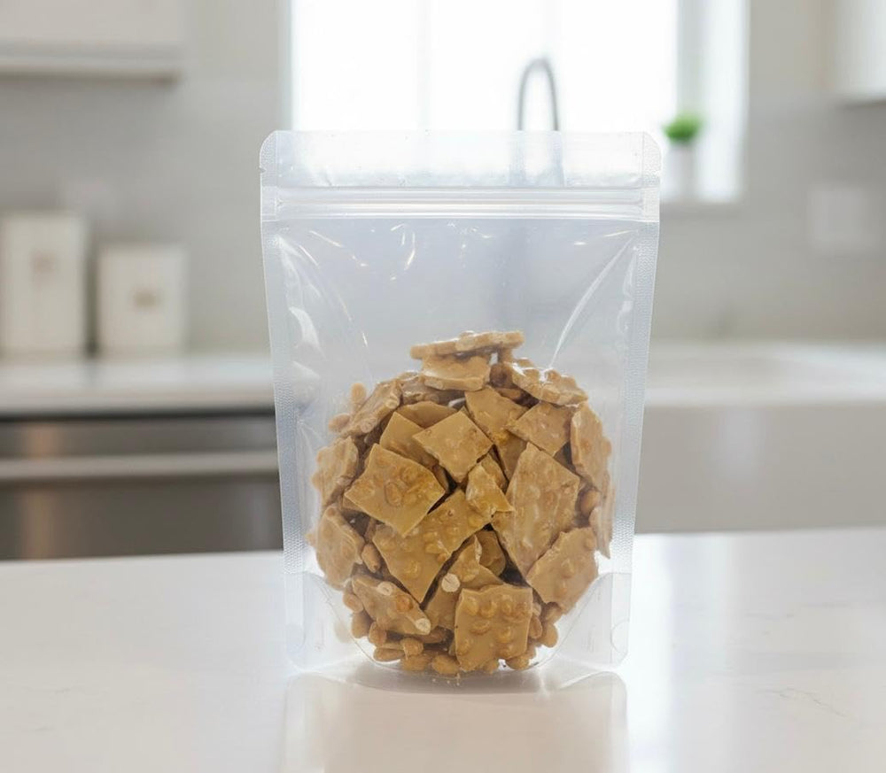 SweetGlob Old Fashioned Brittle thin crisp slice highlights golden, snap-worthy texture.