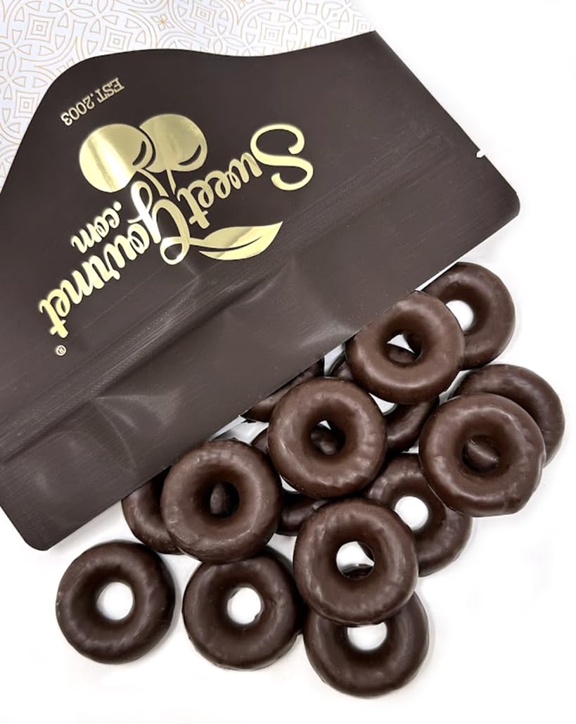 Single jelly ring on chocolate surface highlighting texture.