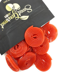 SweetGourmet Italian strawberry licorice wheel close-up, vivid red color and firm texture for snacking.