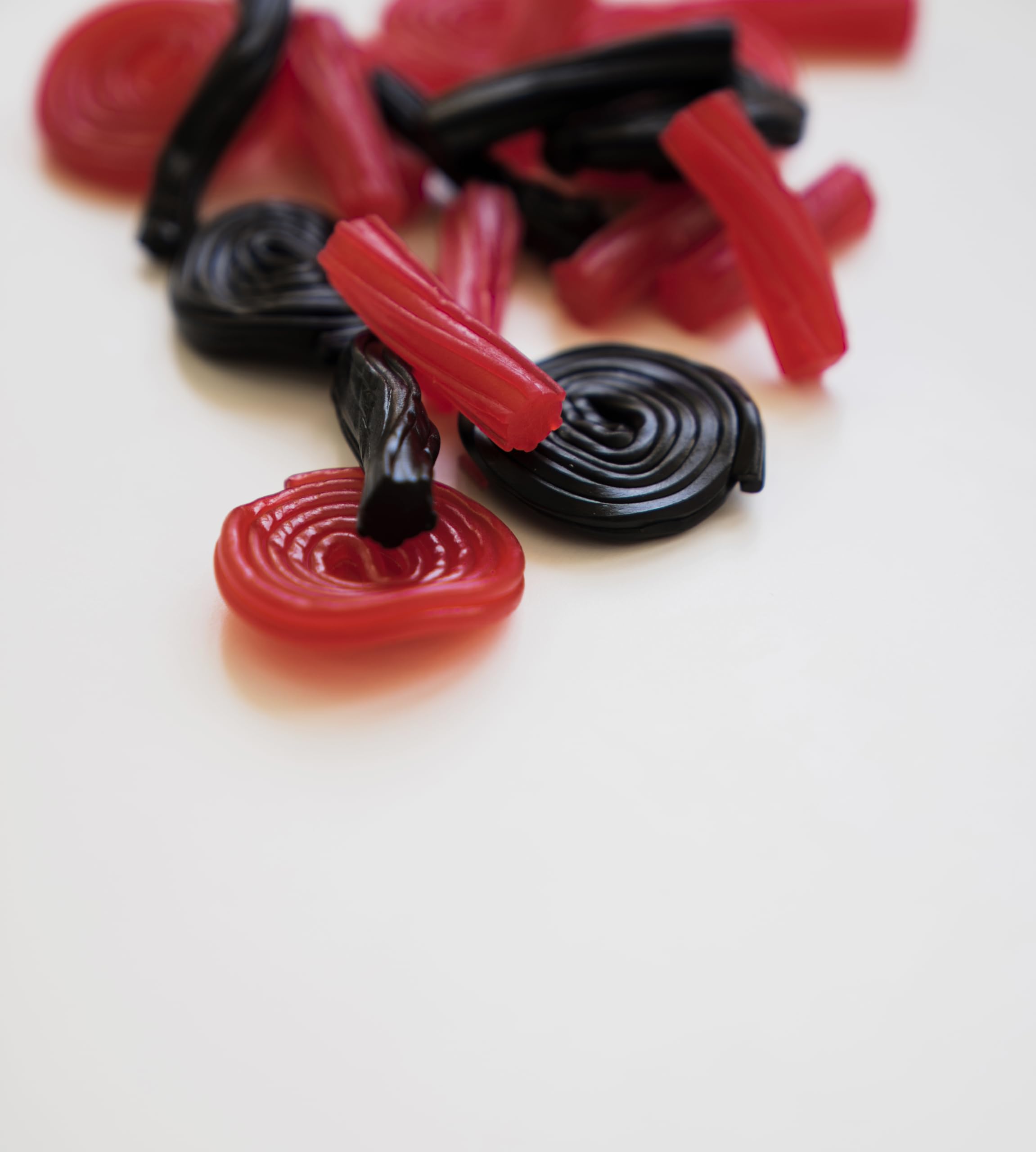 Italian strawberry licorice wheel displayed, ideal for party favors and gifting.