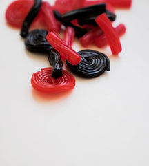 Italian strawberry licorice wheel displayed, ideal for party favors and gifting.
