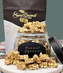 SweetGourmet peanut brittle squares bite-sized serving piece close-up.