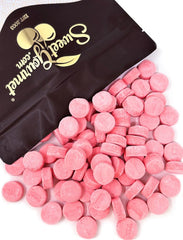 SweetGourmet Pink Wintergreen Lozenges bulk bag on counter, ideal for daily refreshment.
