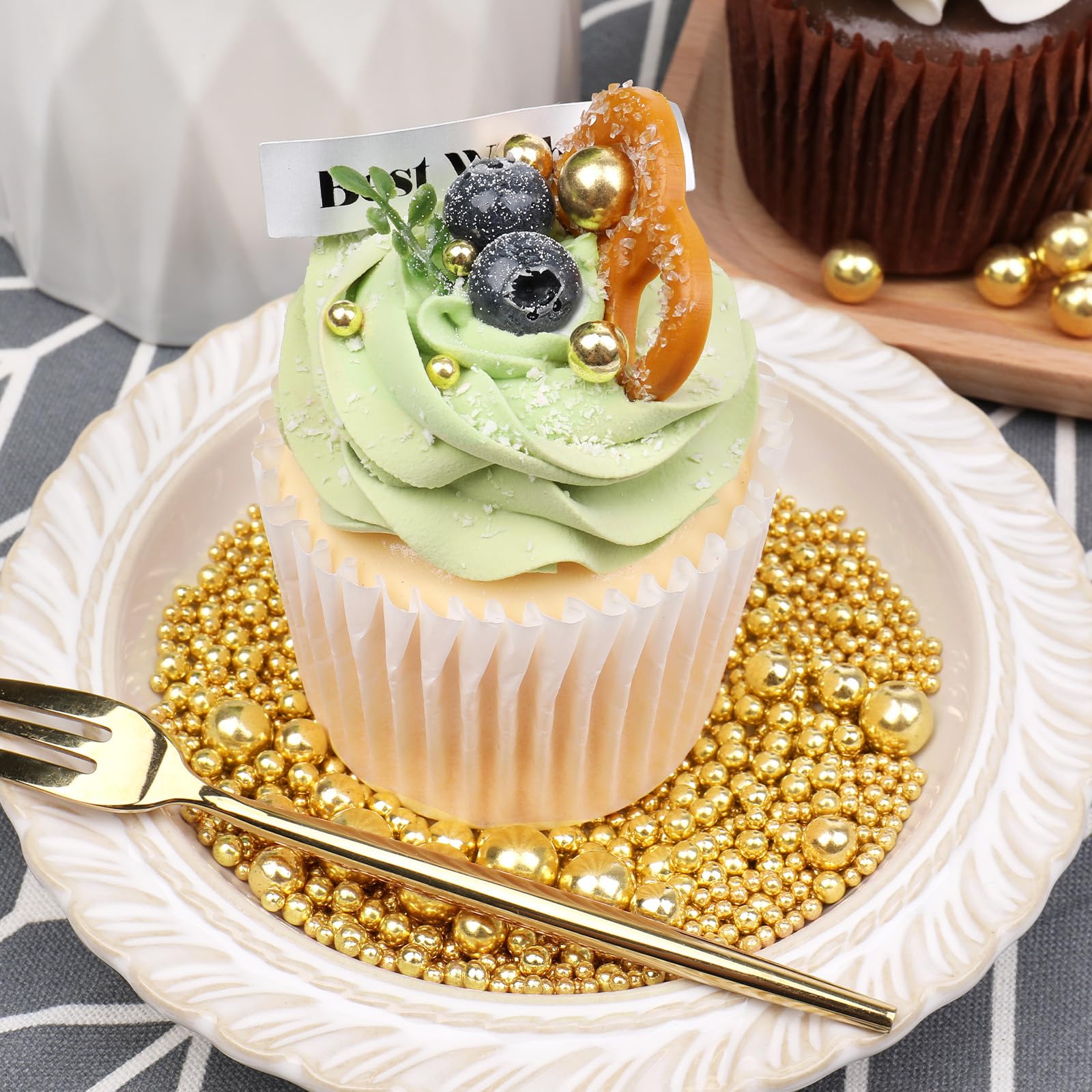 SweetGrove Gold Sprinkles on cupcake tops for a festive finish.