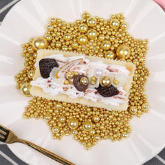 SweetGrove Gold Sprinkles as ice cream toppings with glossy glow.