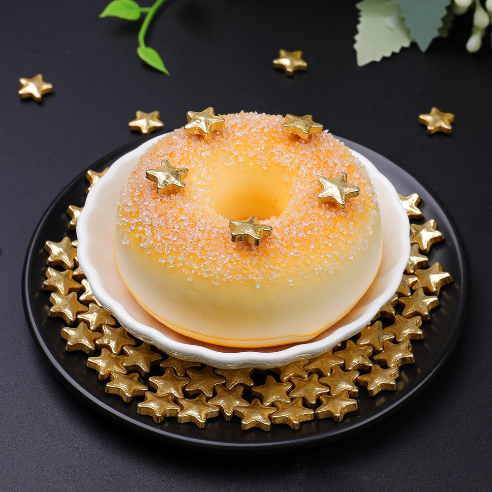 SweetGrove gold star sprinkles sprinkled on a cookie for glam detail