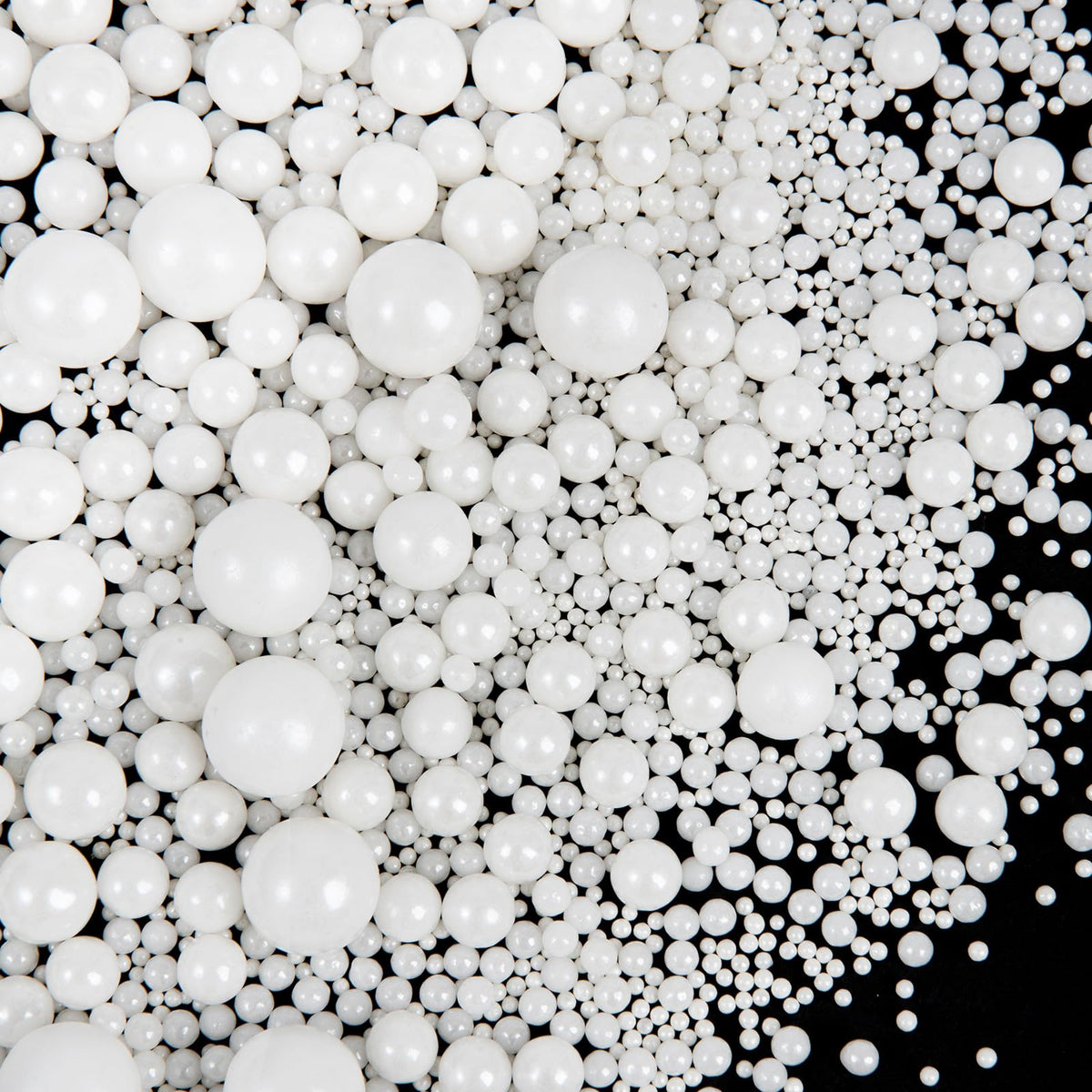 SweetGrove White Pearl Sprinkles on a cake for timeless wedding decoration.
