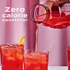 Pouring Sweet'N Low into a cup for a light, calorie-free sweetness.