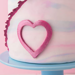 Sweets Indeed edible glitter on cookies delivers festive sparkle and professional finish.