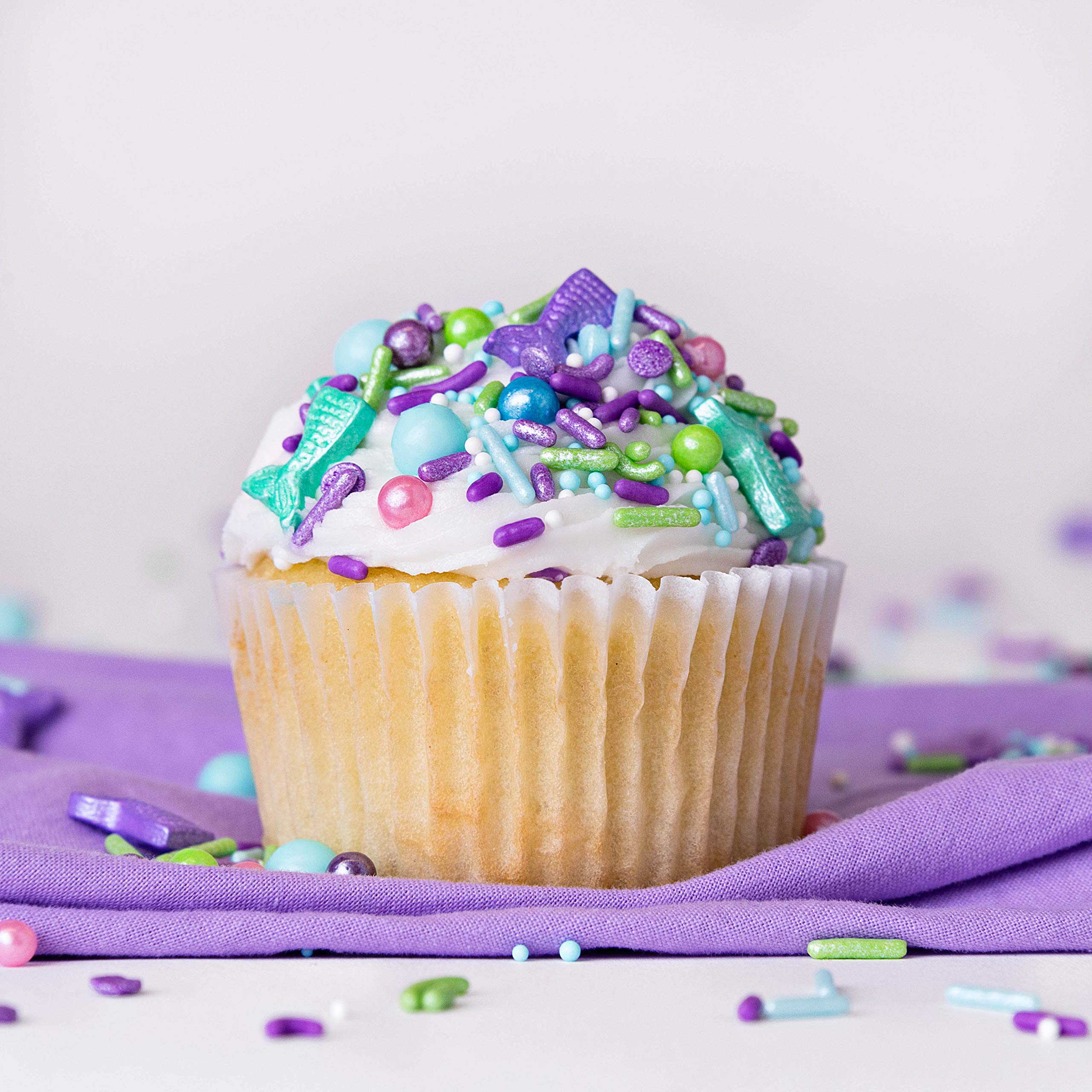Sweets Indeed Mermaid Sprinkles decorate cookies with playful ocean hues.