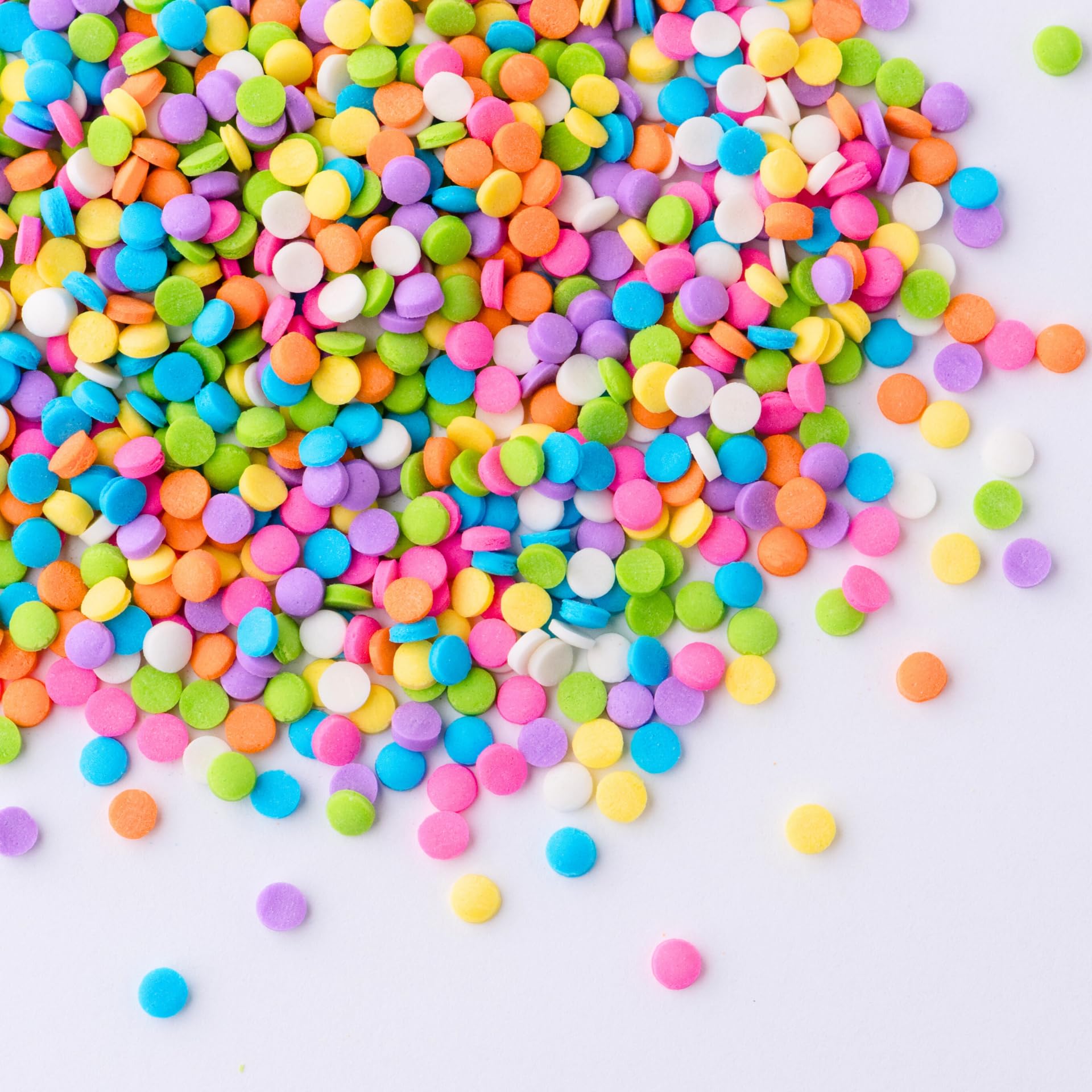Sweets Indeed pastel confetti circle sprinkles sprinkled over a cake for spring celebration