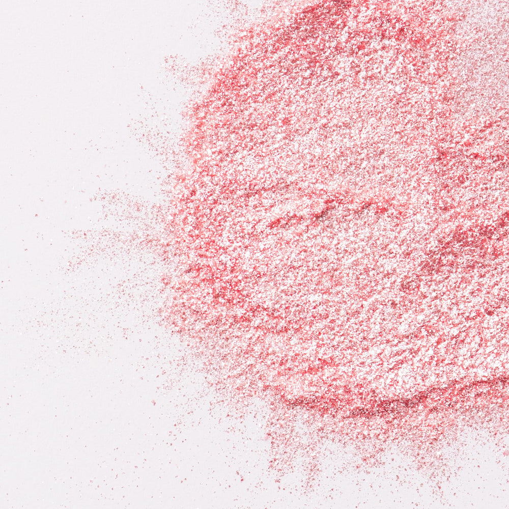 Buttercream topped with Sweets Indeed pink glitter for vibrant dessert sparkle.