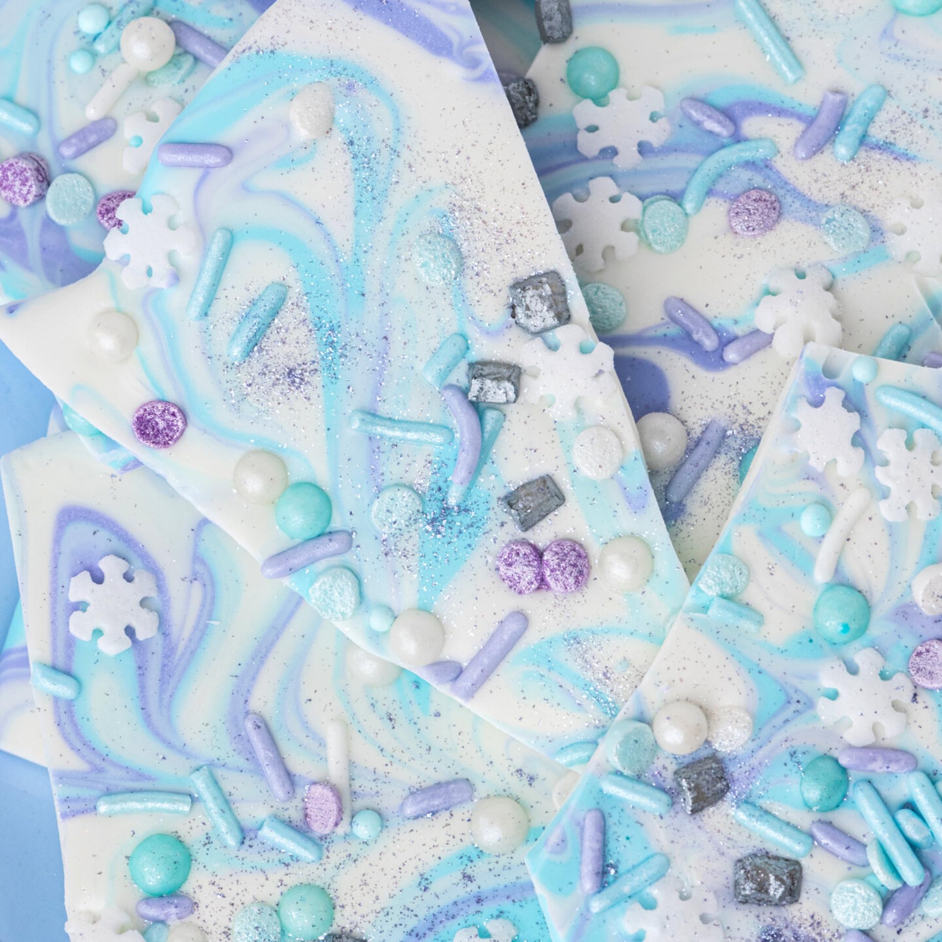 Sweets Indeed purple edible glitter at a party table for a shimmering centerpiece