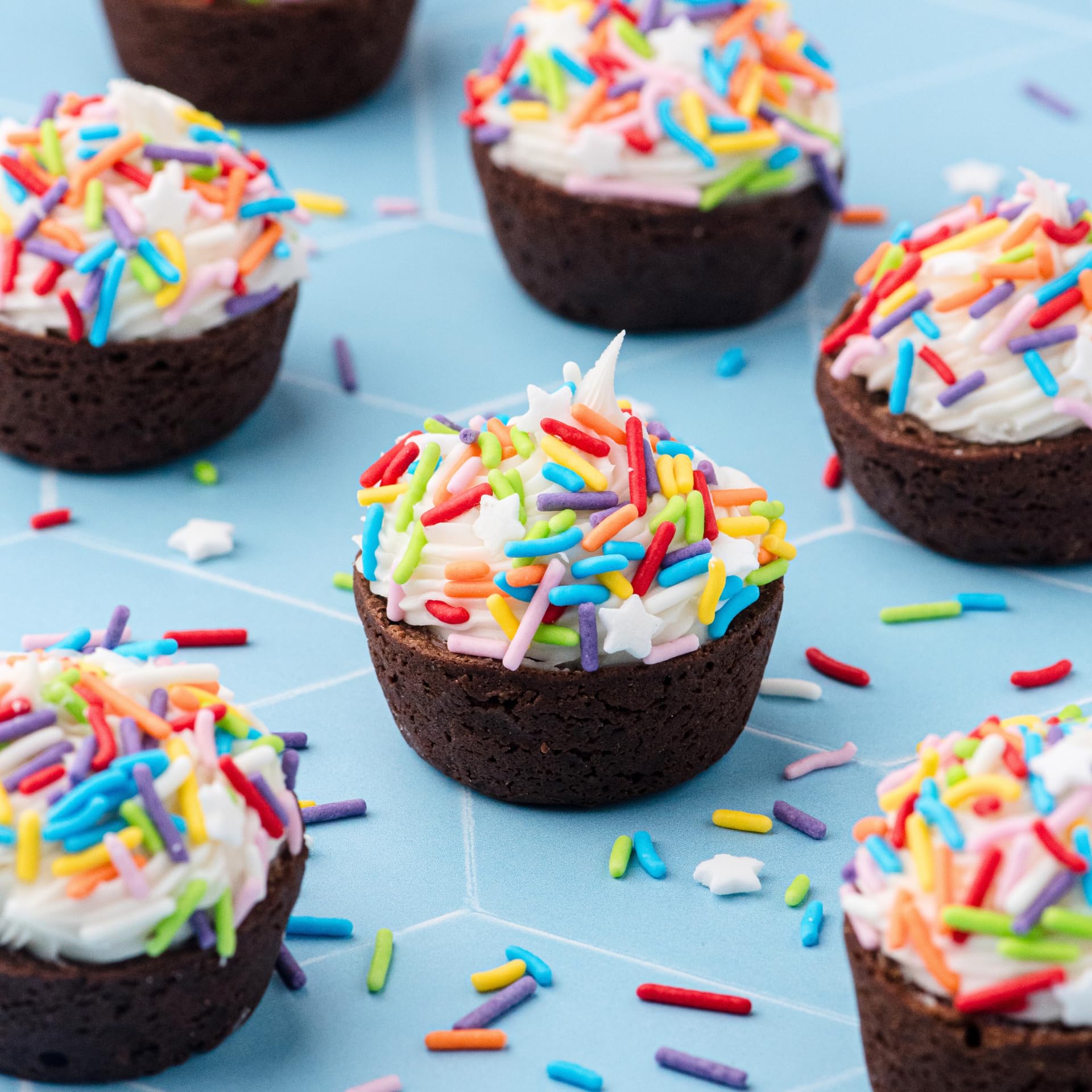Sweets Indeed Rainbow Jimmies decorate a cake for bold decoration.