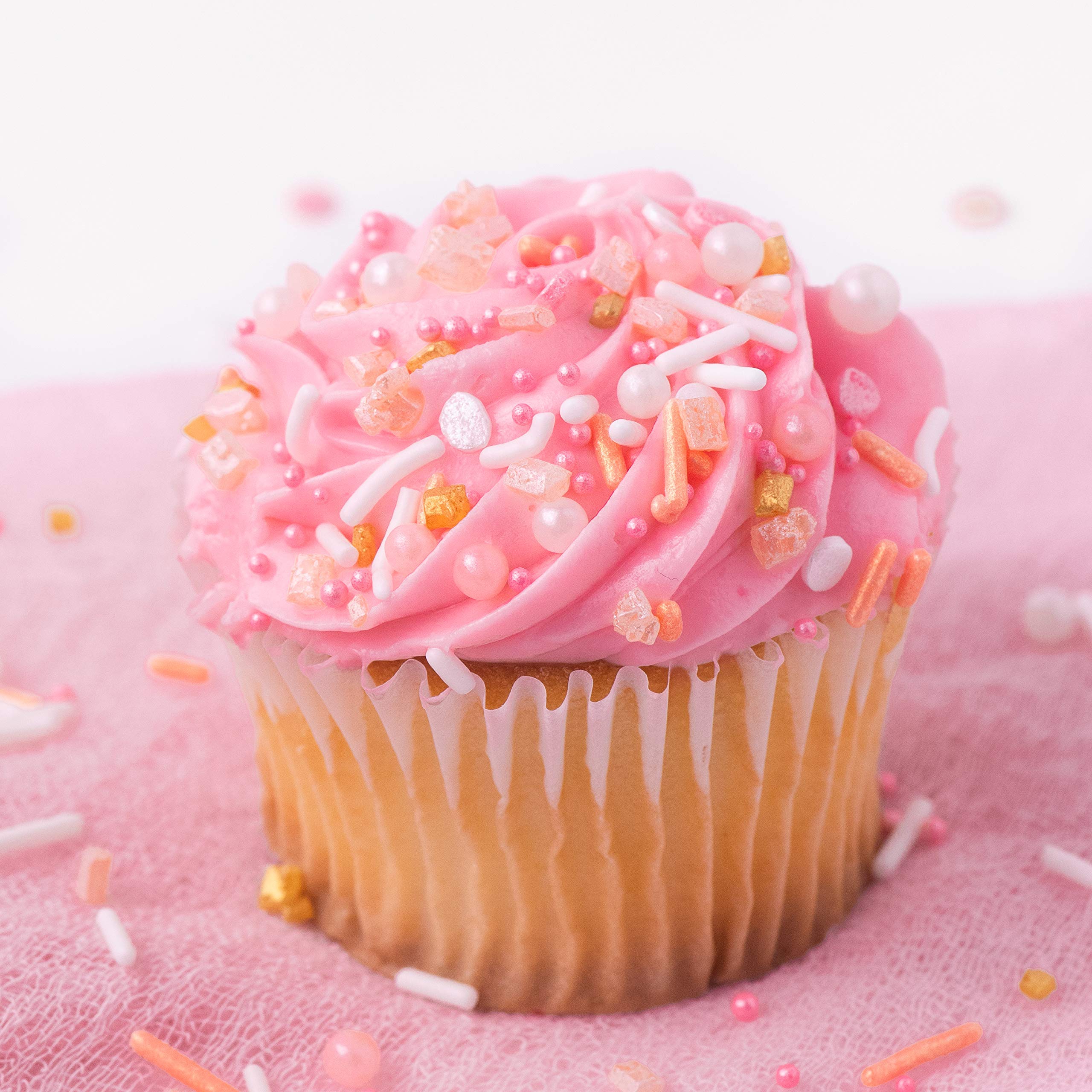 Sweets Indeed Peach Rose Gold sprinkles on cookies for eye-catching topping.